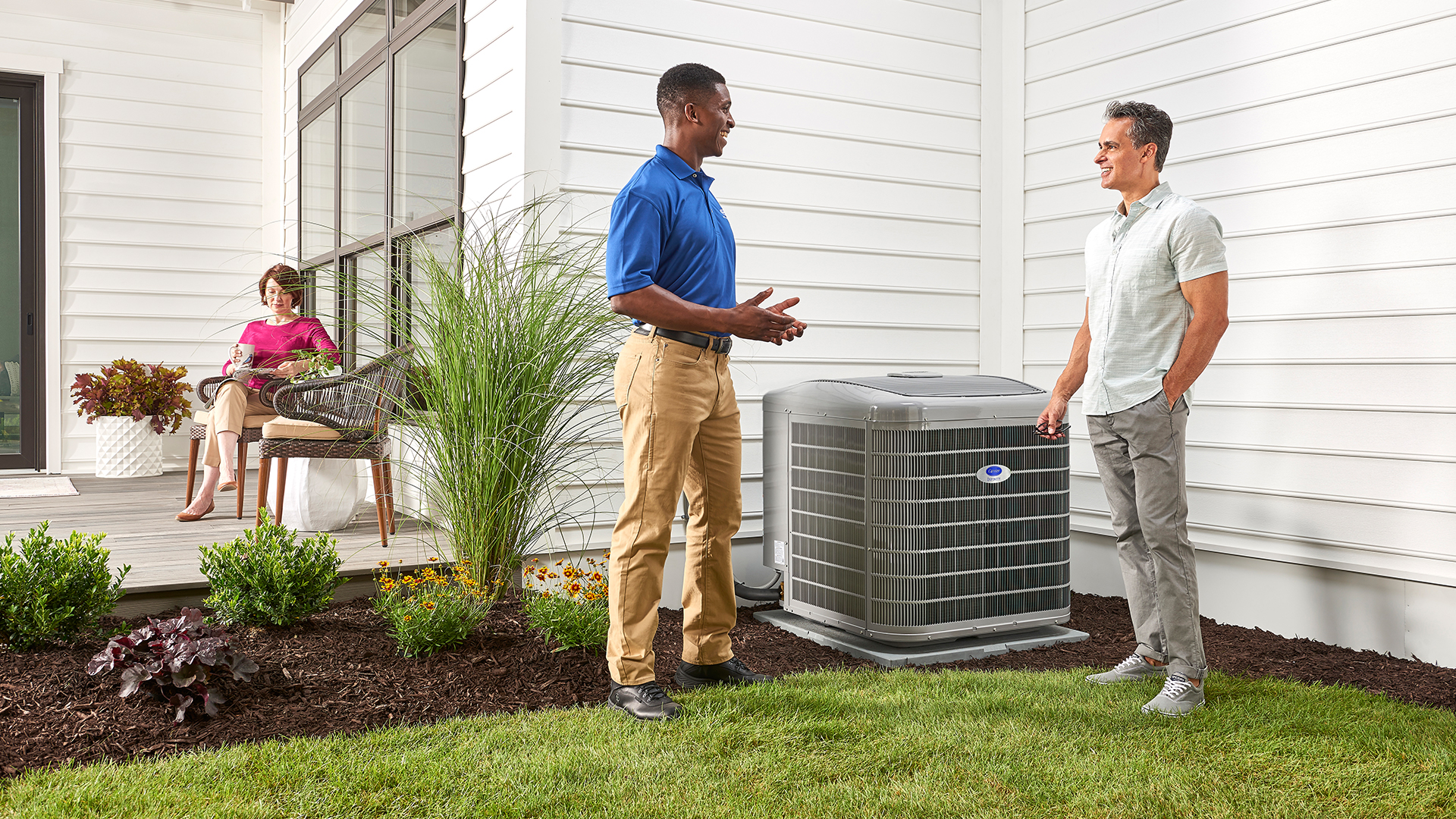 Service technician conducting air conditioner repair