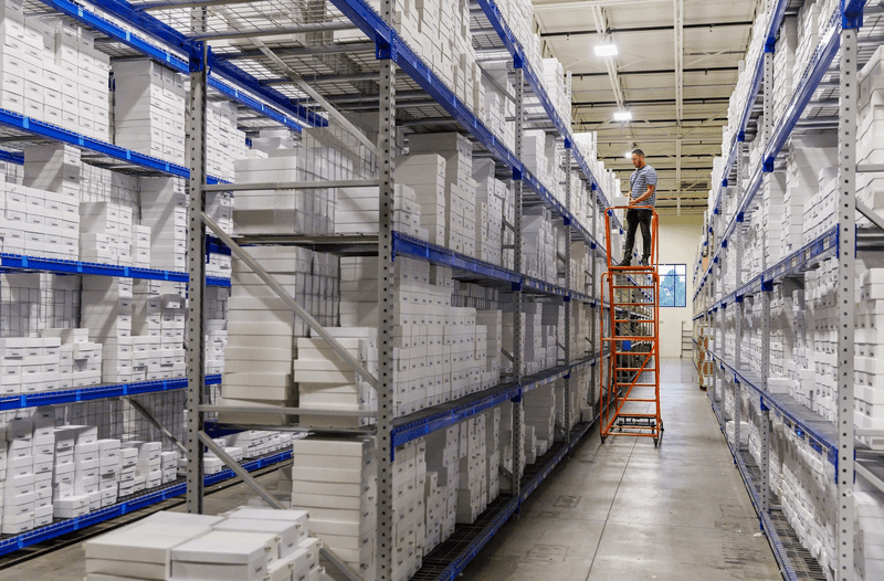 Employee at E-commerce online Shopping distribution center.