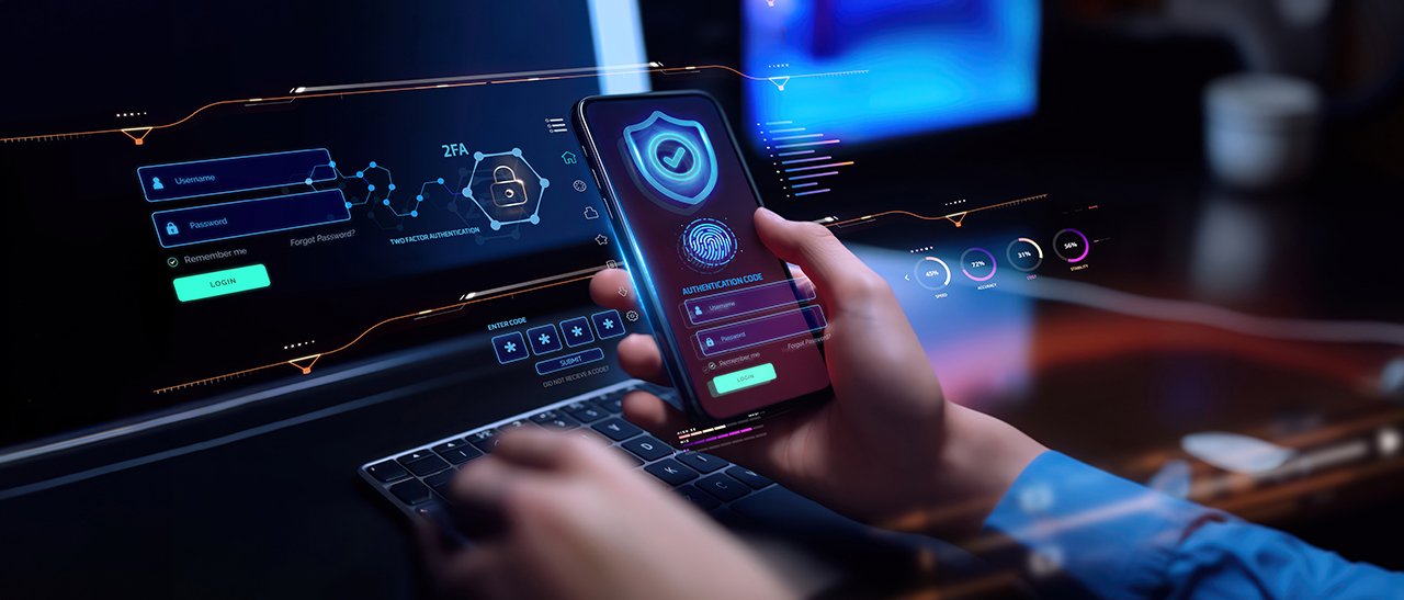 cybersecurity person on laptop and phone