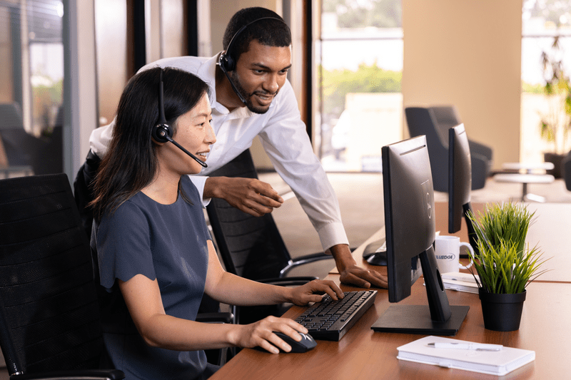 People looking at a monitor