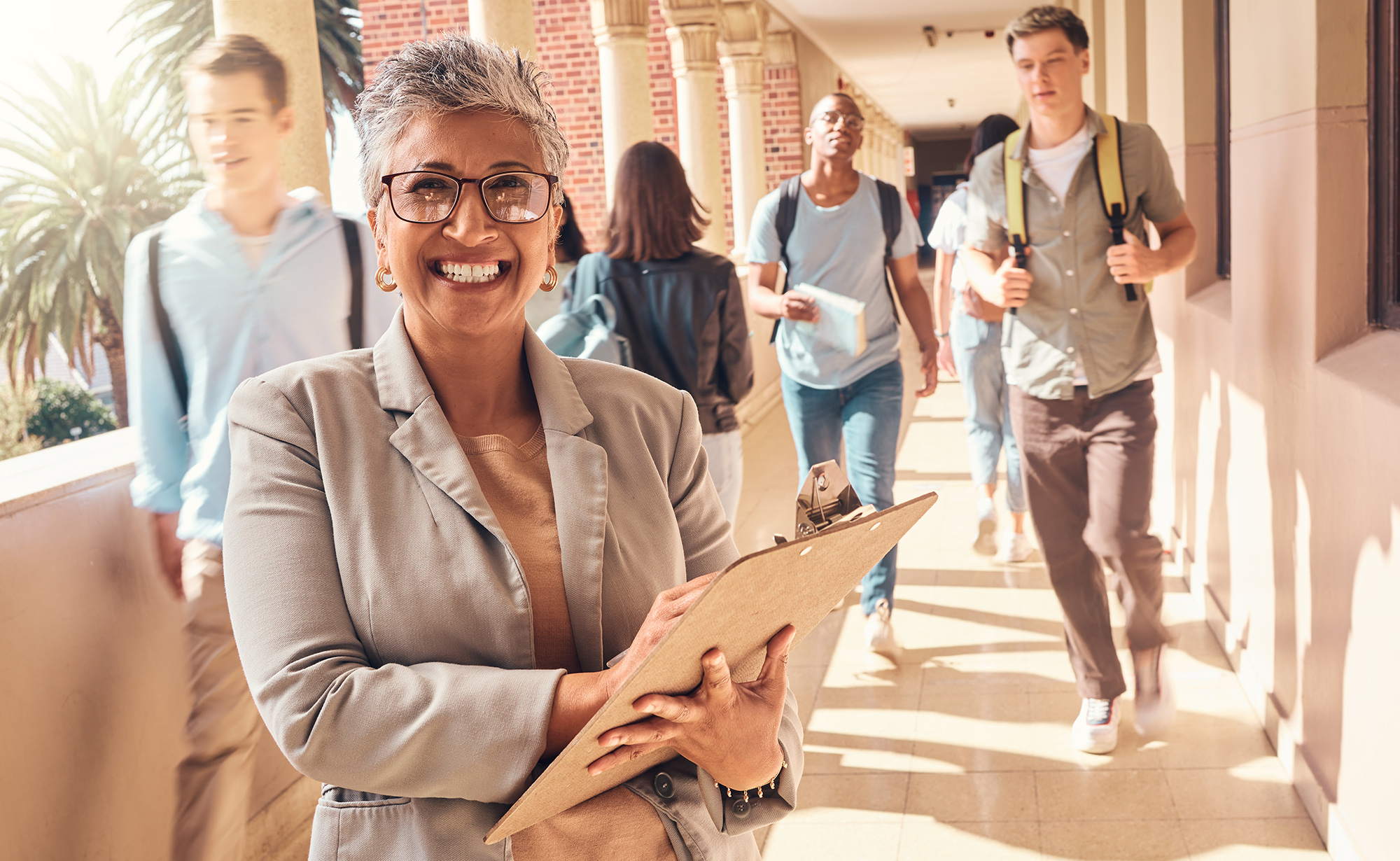 Teacher in hallway with students