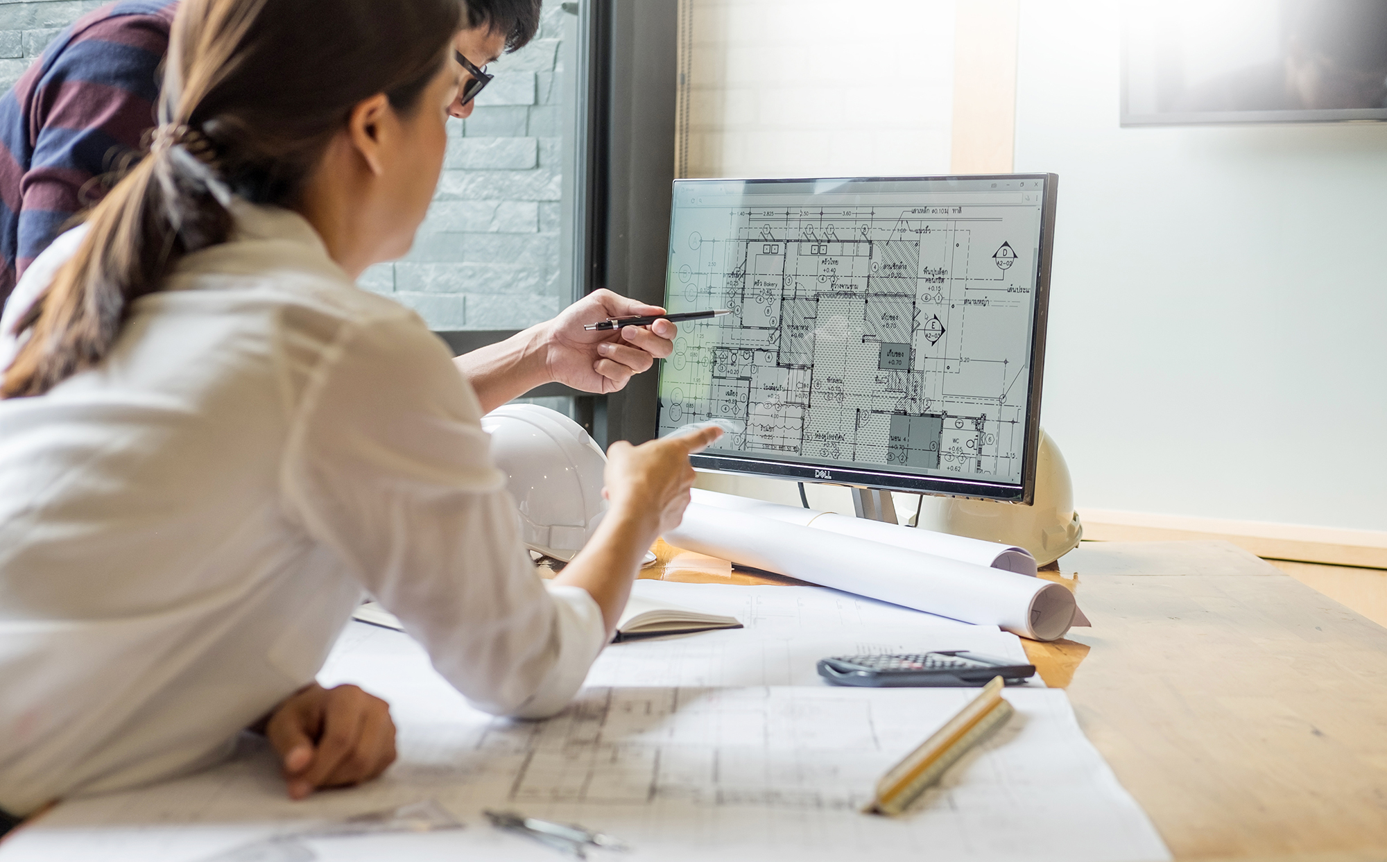 People on computer viewing CAD designs