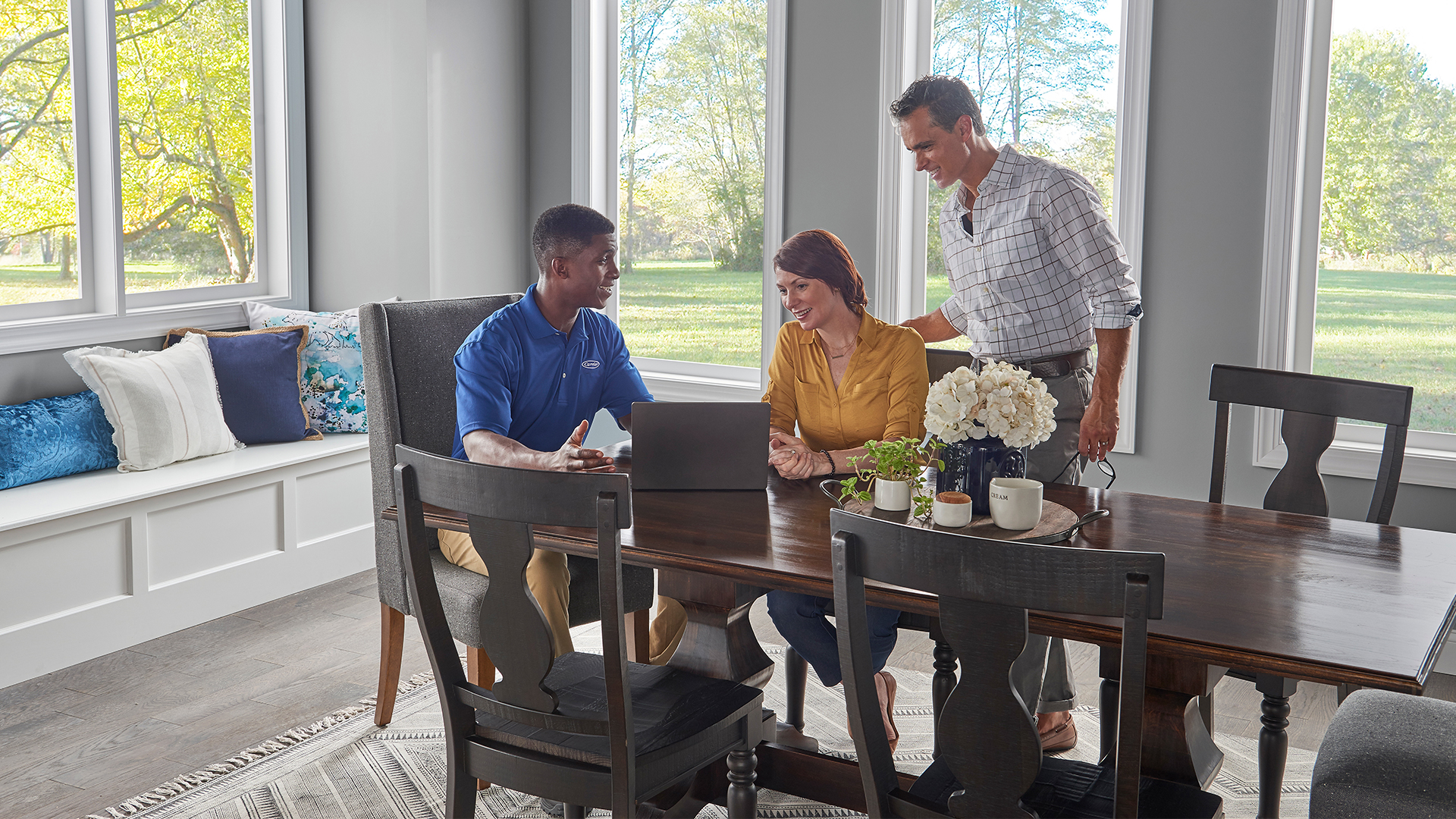 Carrier dealer going over gas furnace prices with customers