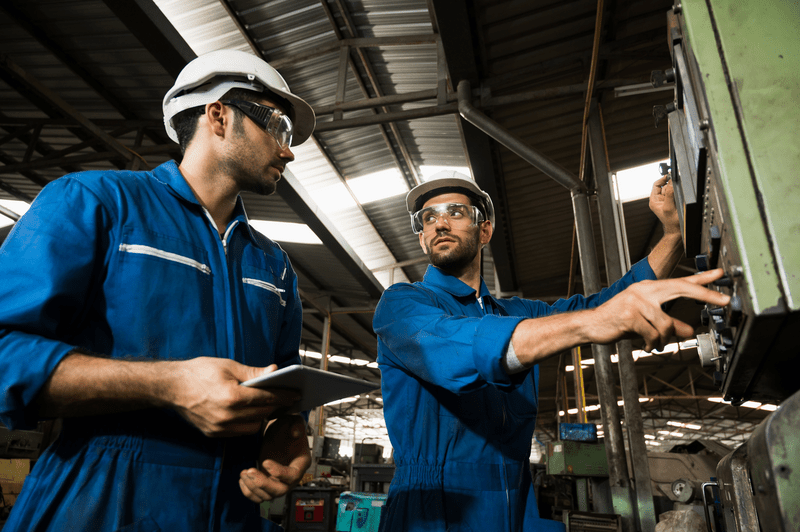 Industrial engineers wearing white hard hats