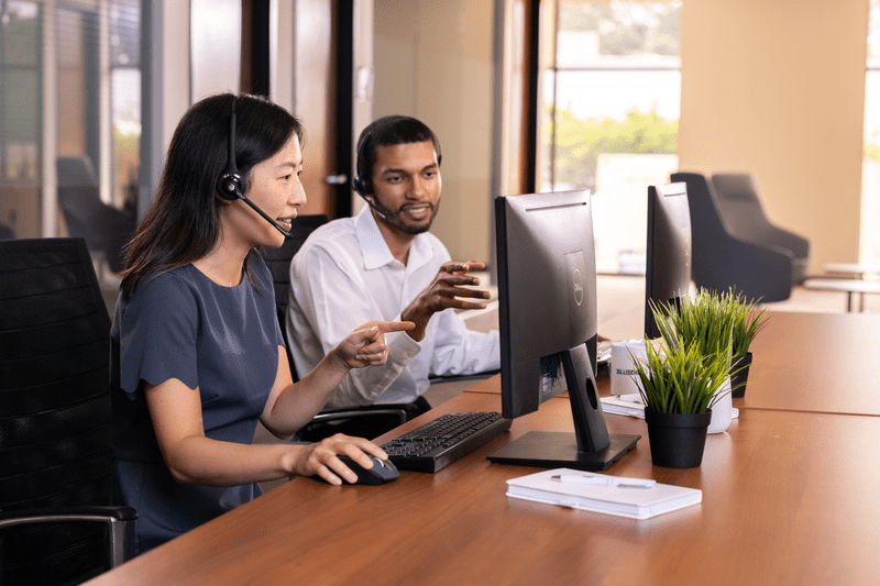 People looking at a monitor