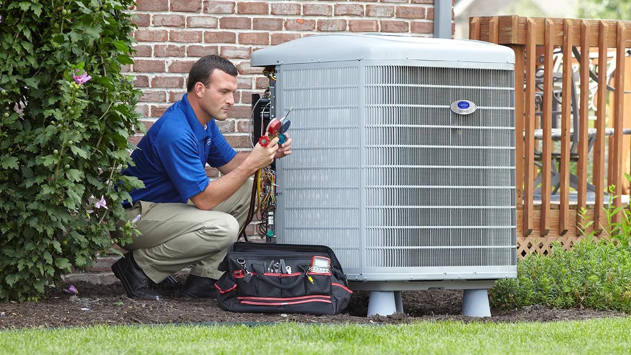 A dealer servicing an AC unit with Puron Advance refrigerant