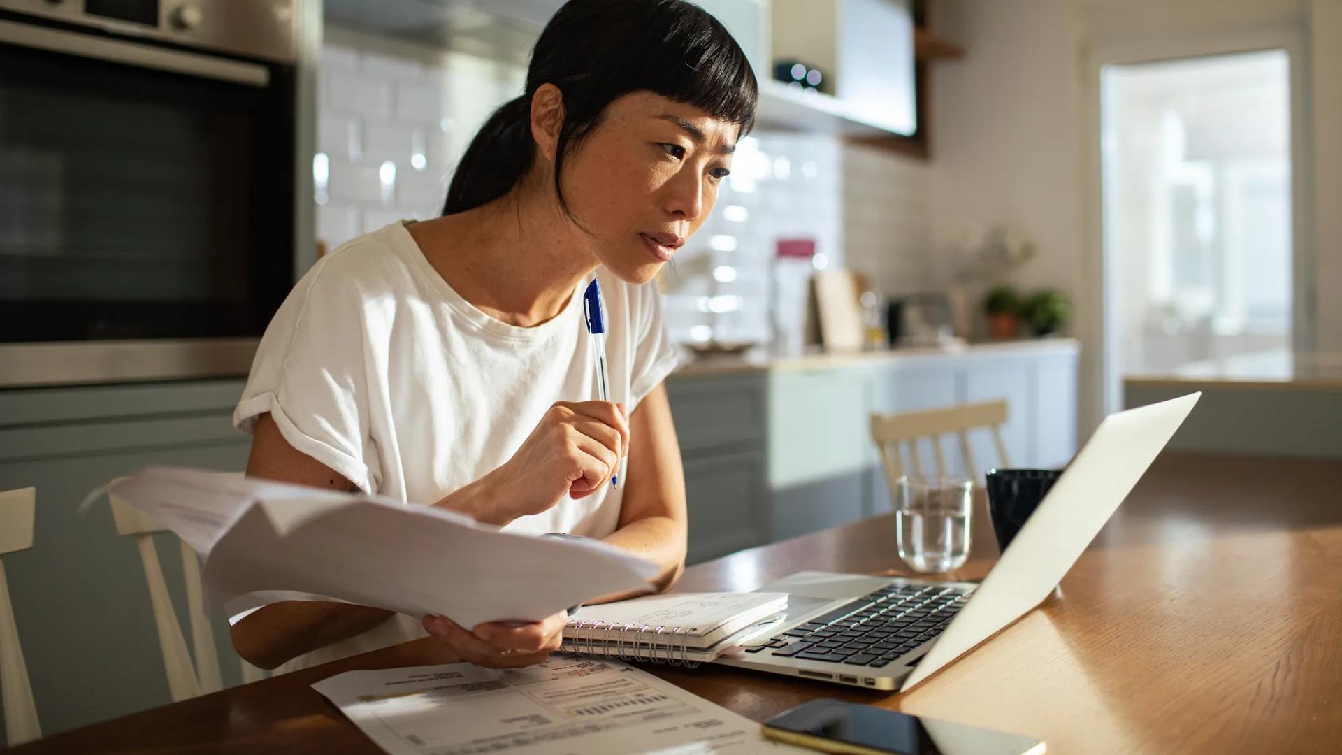 Woman looking at laptop