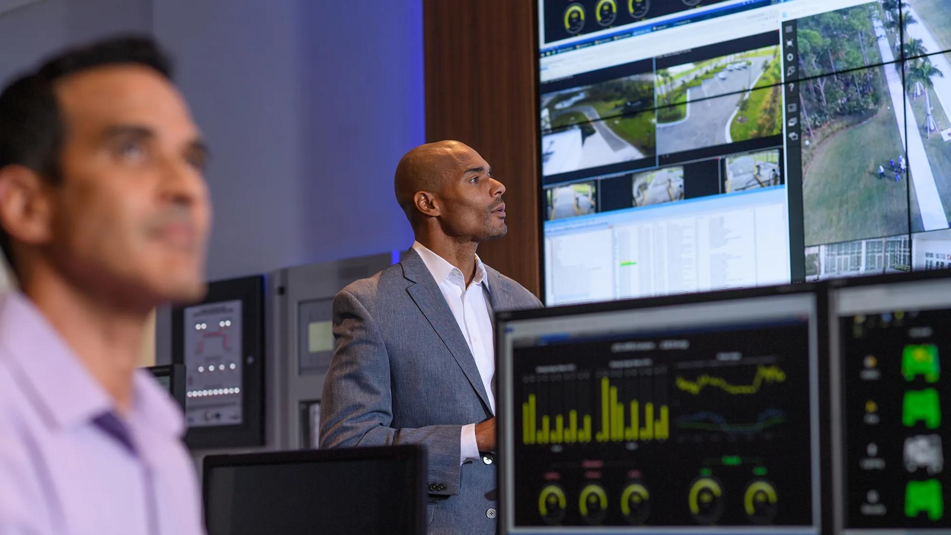 man sitting at computer at computer data center
