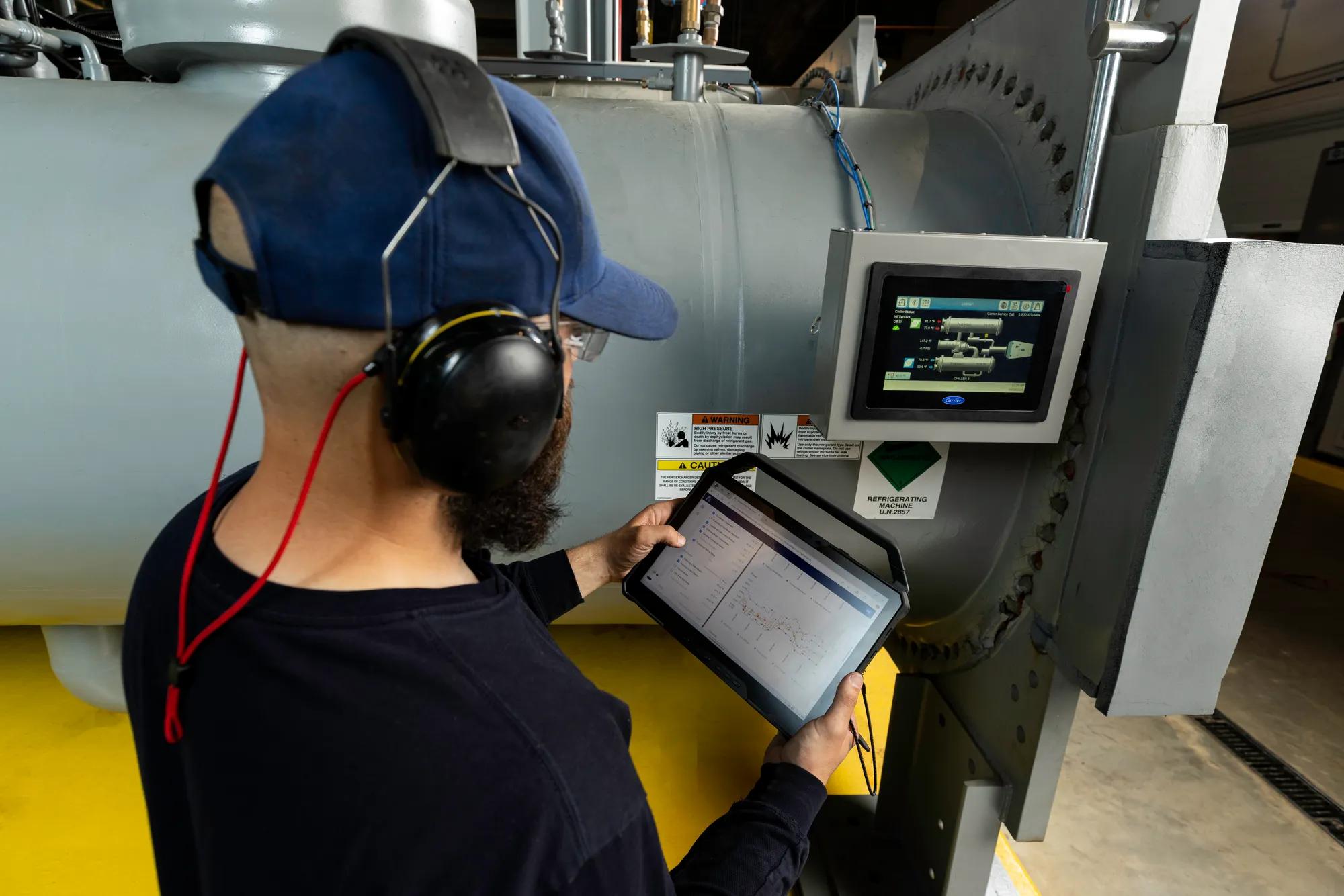 CHVAC Tech looking at monitors