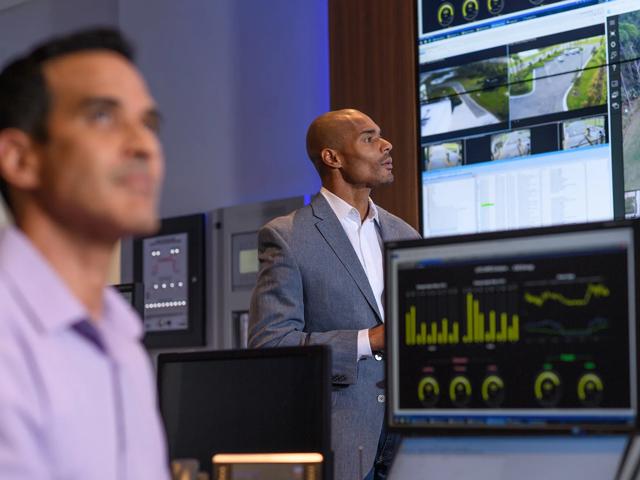 Men in control command center