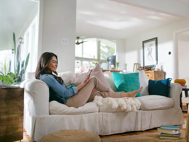 Lady using thermostat