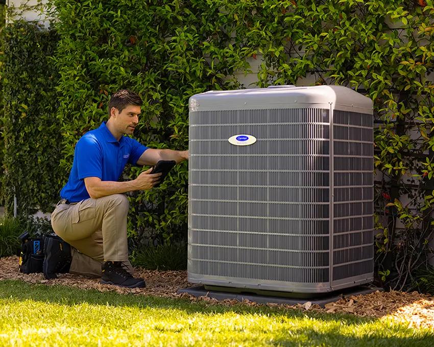 A Carrier dealer installing a new HVAC system