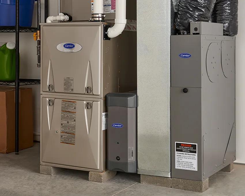 Whole home air purifier installed next to a furnace