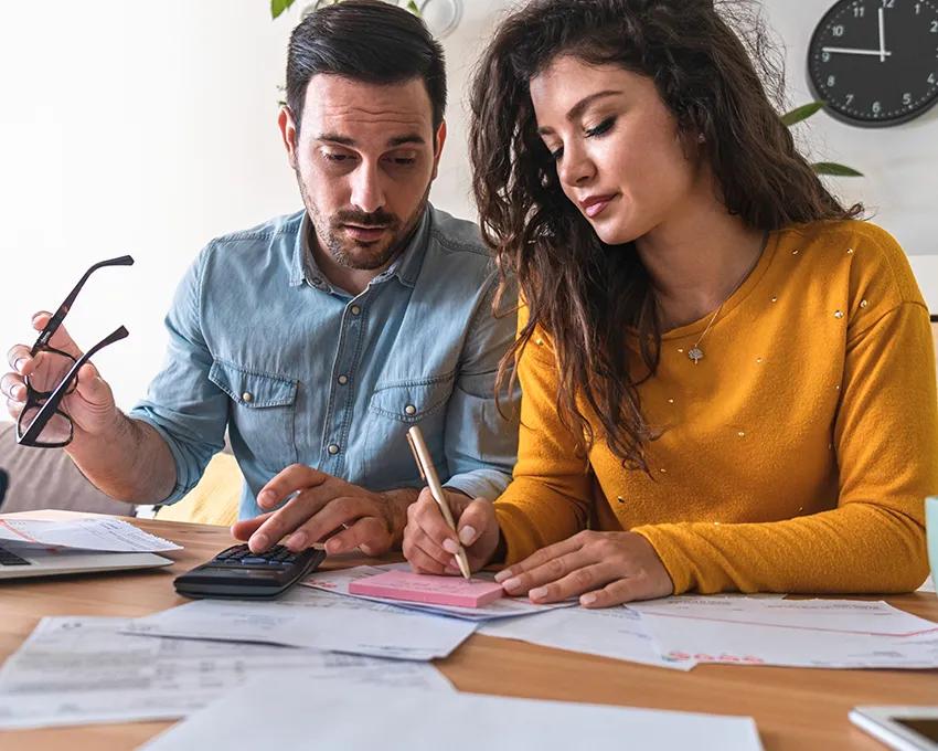 A couple researching financing and rebates for HVAC systems