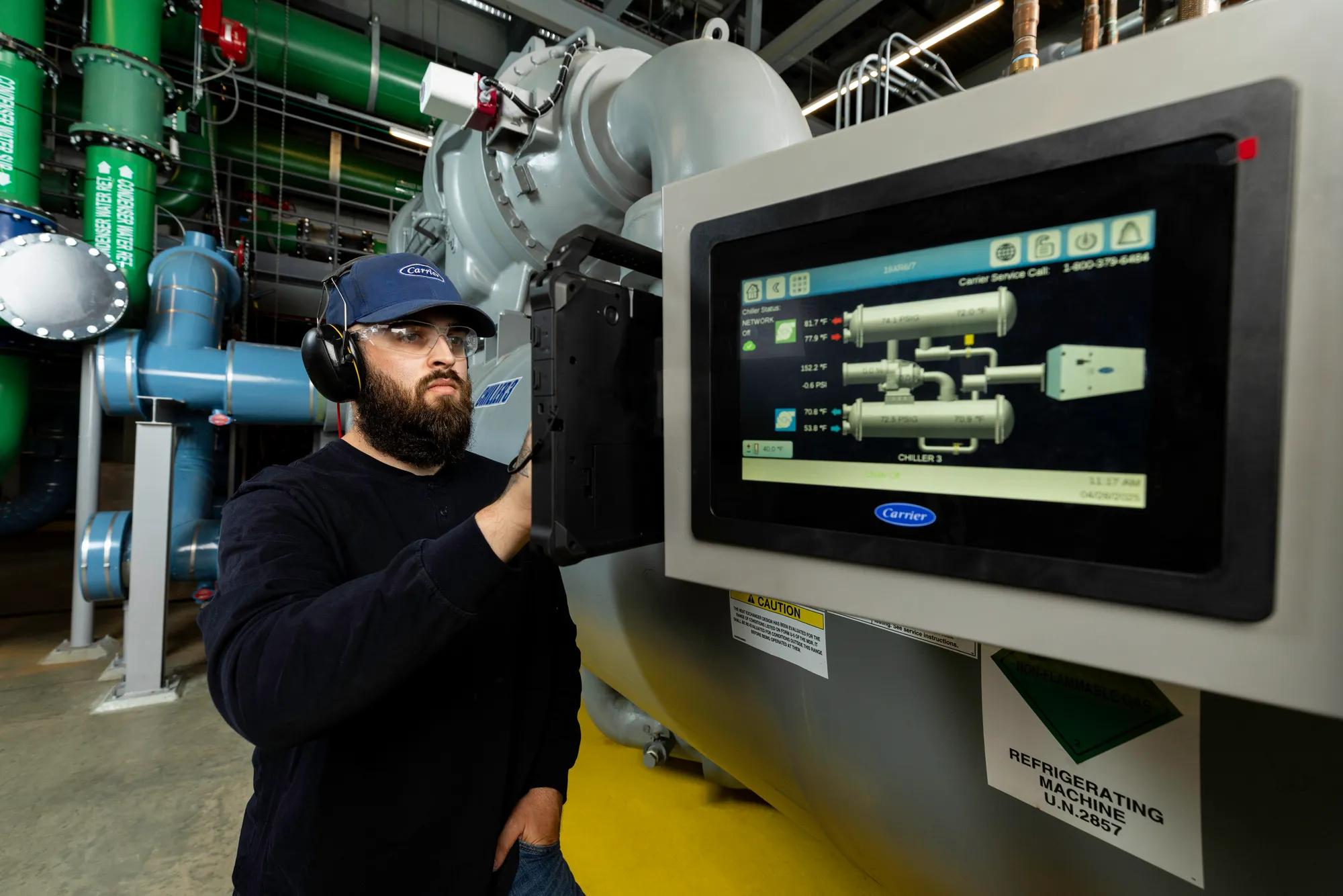 Carrier tech examining a chiller